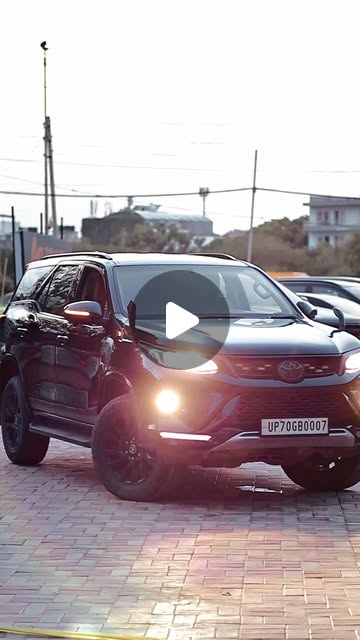 Fortuner with a Legender conversion kit and glossy black PPF